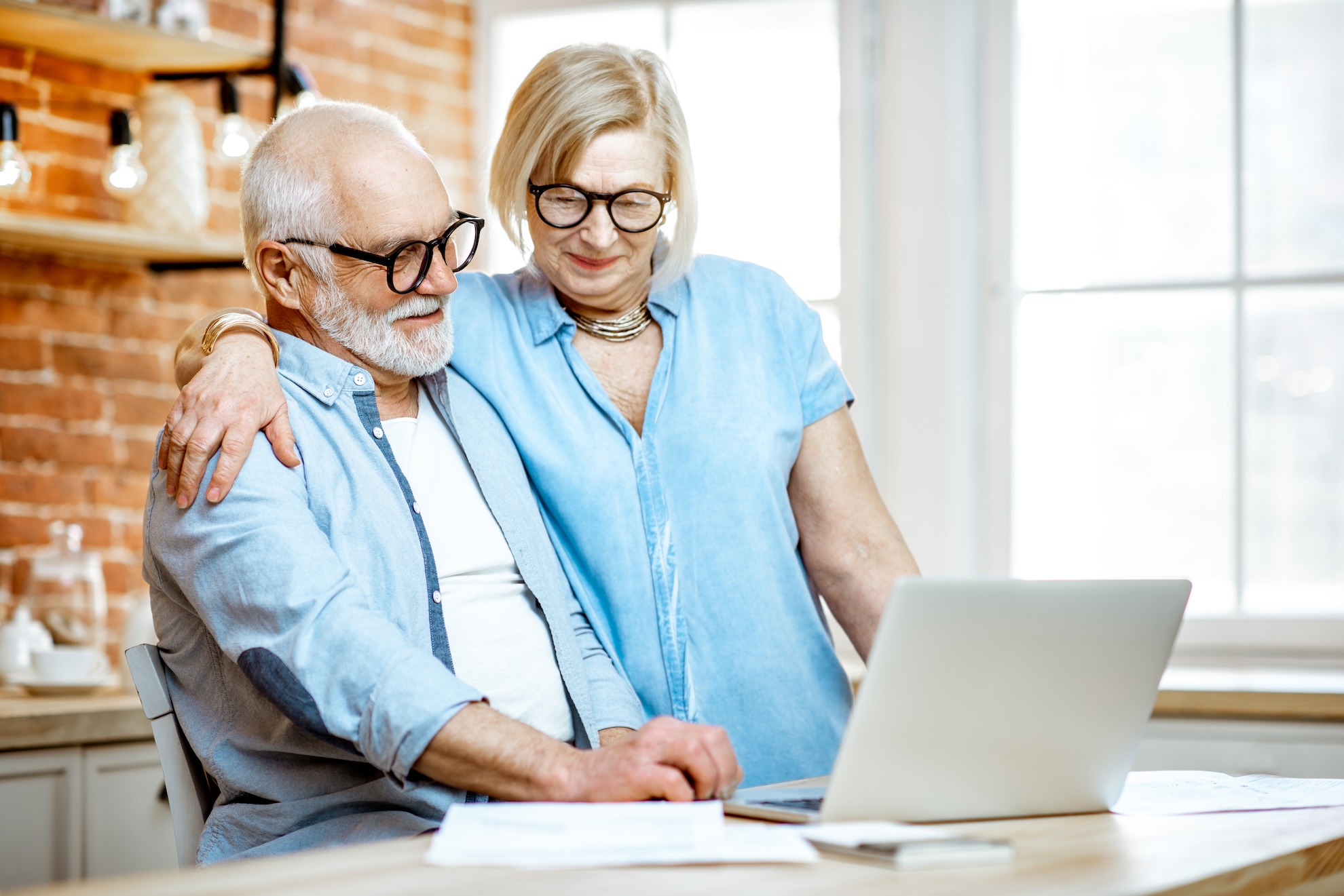 Senior couple with laptop at home Understanding your Full Retirement Age SSA